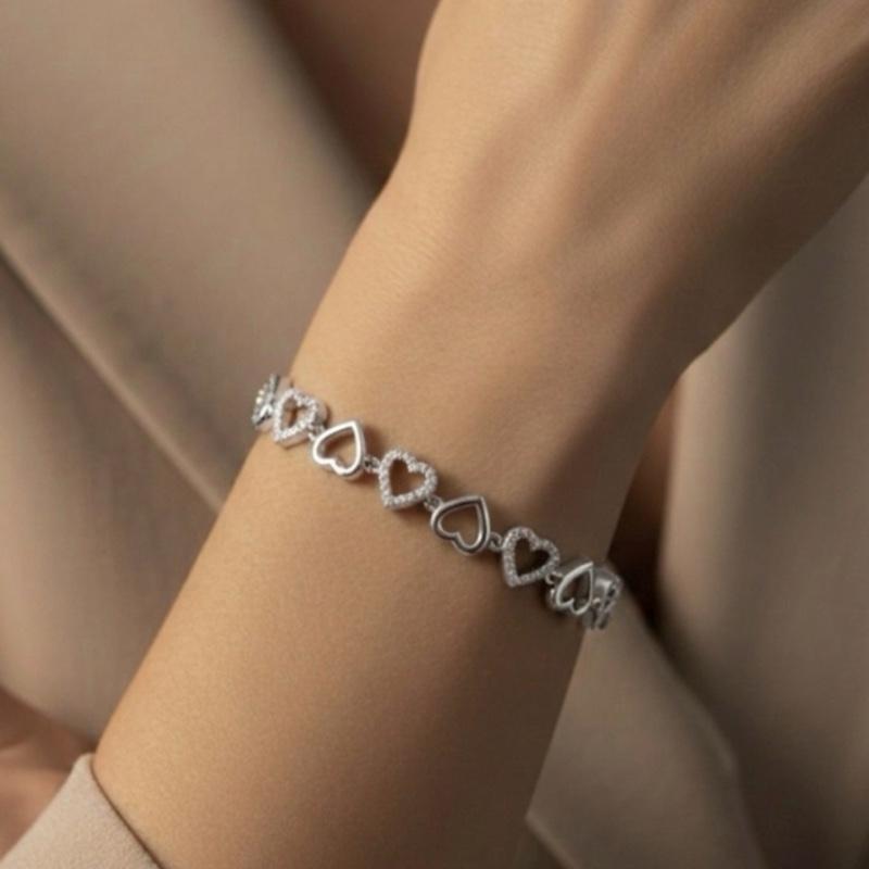 Bracciale COR A COR con Cuori Stilizzati e Zirconi Bianchi Elegante e Romantico per un Stile Femminile