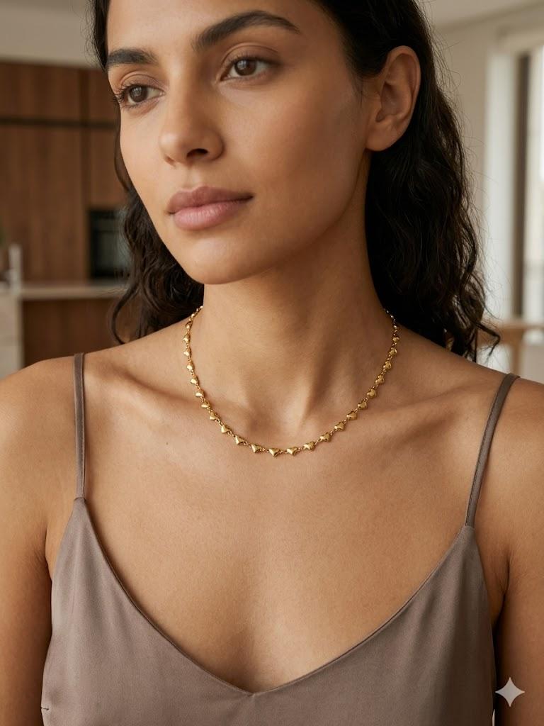 Collana cuoricini dorati in acciaio