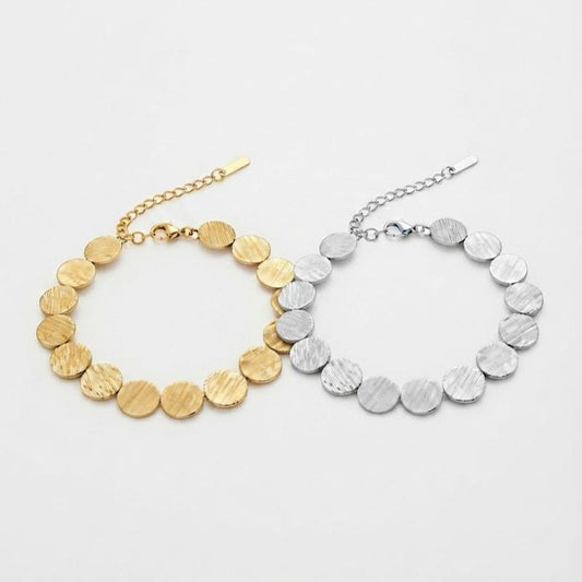 Bracciale Soleil in Acciaio Inossidabile con Disegno a Dischi Dorati e Argentati per un Look Elegante e Moderno