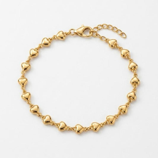Bracciale Cuoricini in Acciaio Dorato con Design Elegante e Dettagli a Forma di Cuore per un Look Raffinato