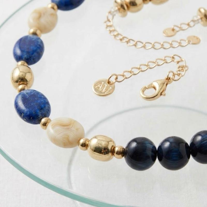 Collana Eclissi collezione artigianale in acciaio anallergico con pietre in resina e dettagli dorati per un look elegante e sofisticato