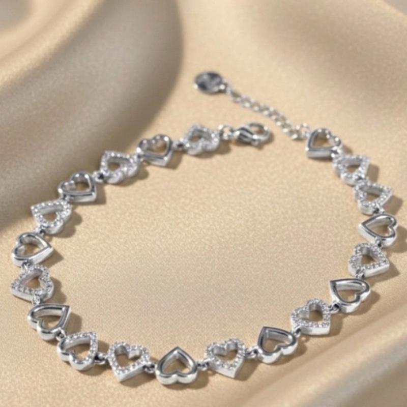 Bracciale COR A COR con Cuori Stilizzati e Zirconi Bianchi Elegante e Romantico per un Stile Femminile