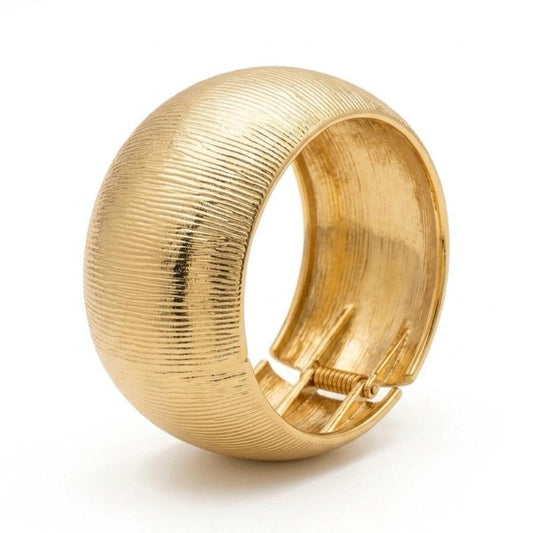Bracciale Rigido in Acciaio con Dettagli Dorati e Design Elegante per un Look Moderno e Raffinato