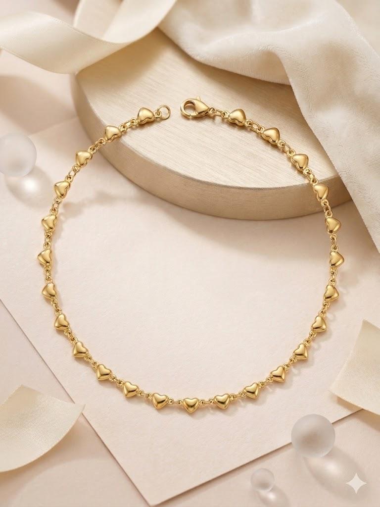 Collana cuoricini dorati in acciaio