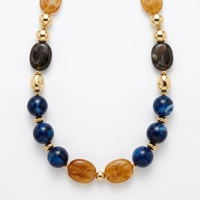 Collana Eclissi collezione artigianale in acciaio anallergico con pietre in resina e dettagli dorati per un look elegante e sofisticato